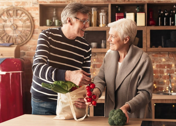 Old couple with groceries